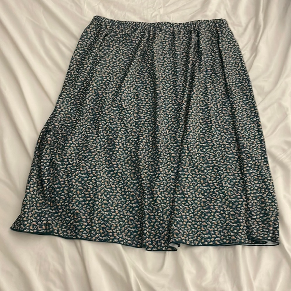 Green midi skirt with purple, yellow and white flowers